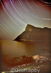 star trails across False Bay looking south towards Cape P... by Geoff Spiby 